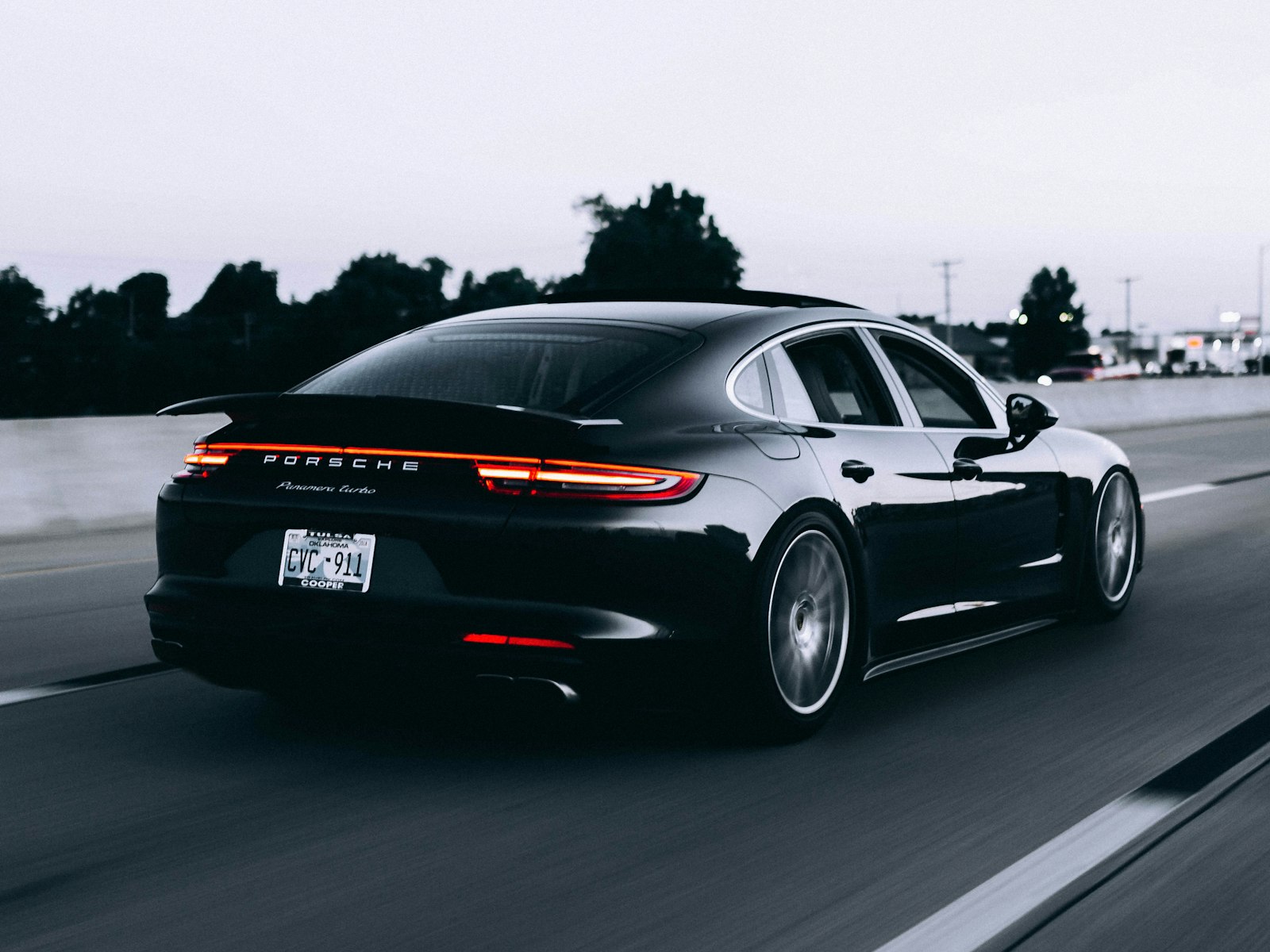 Sports car on a highway at dusk